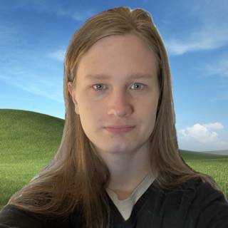 Rebecca, with the Bliss background from Windows XP behind her